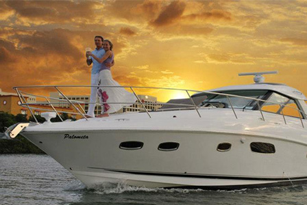 Enjoy a delicious dinner on board a luxury yacht while you sail at sunset in Cancun.